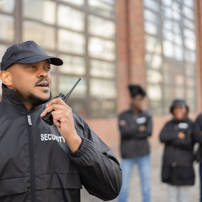 Group Of Security Staff At Event. African Bodyguard Officers